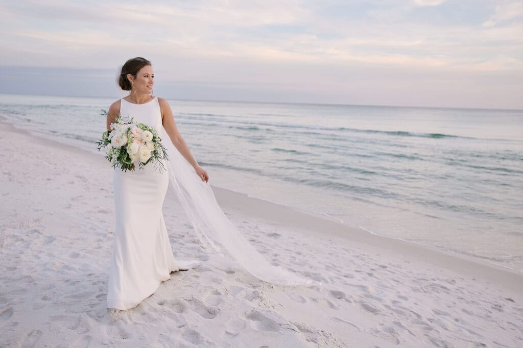 The bride walking at the beach
