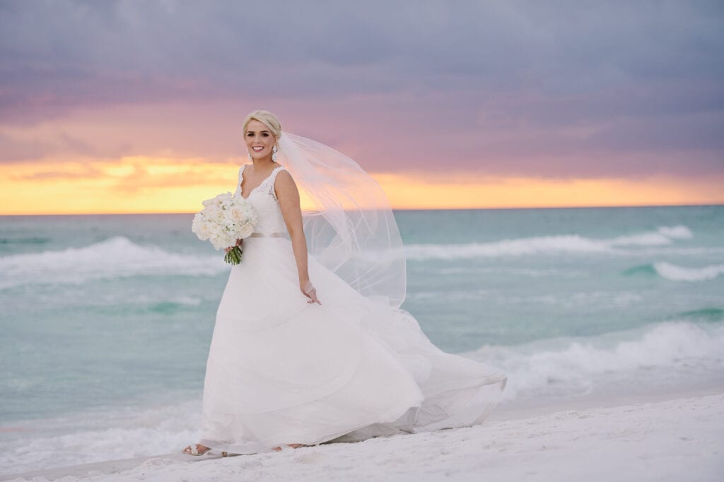 The bride walks by the beach