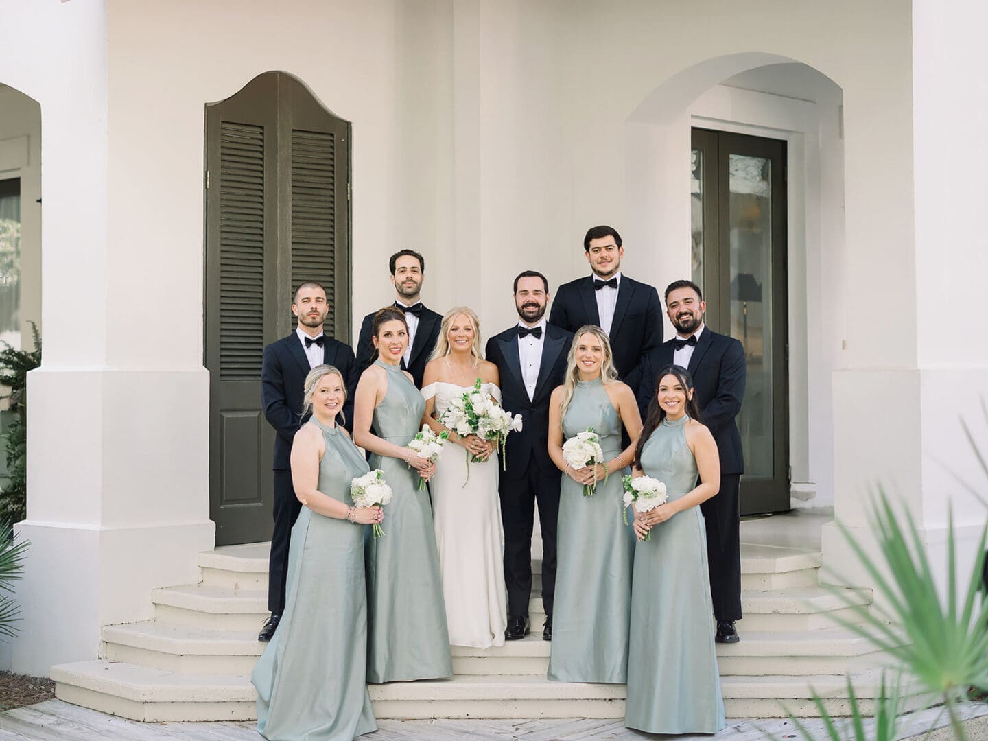 Bridal party posing on the steps