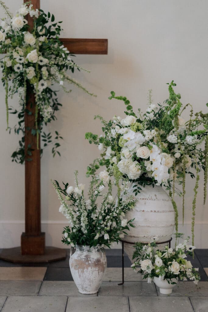 Floral decorations near a wooden cross